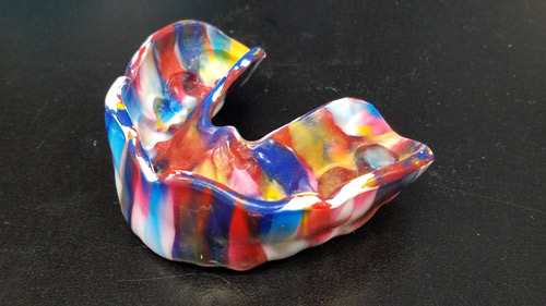 Multi-colored sports mouthguard offering protection for teeth during sports 